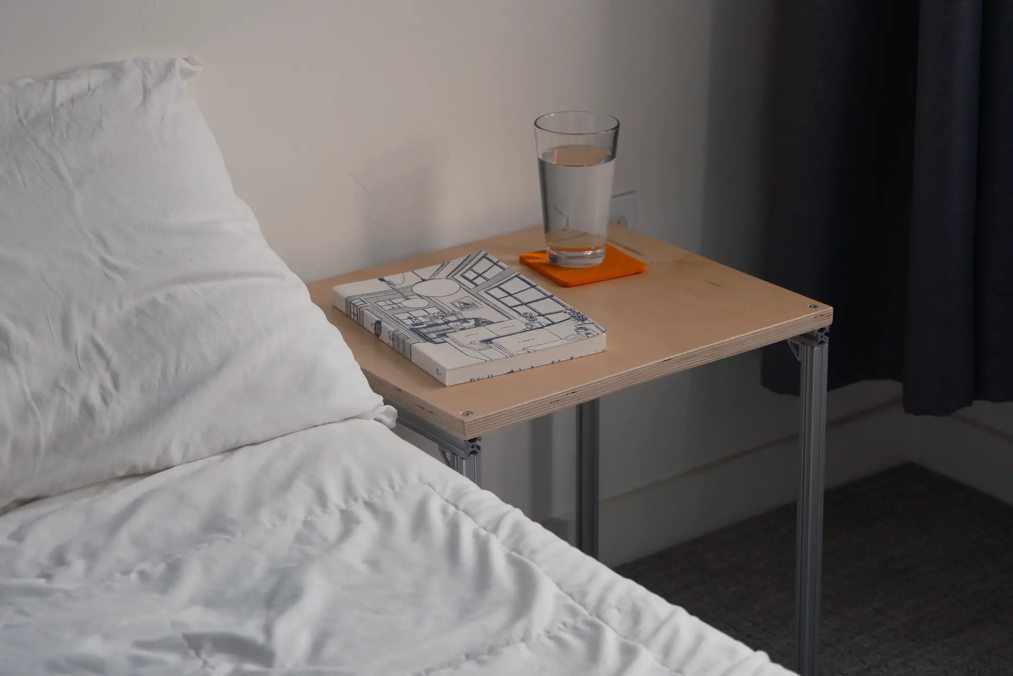 The night table next to a bed